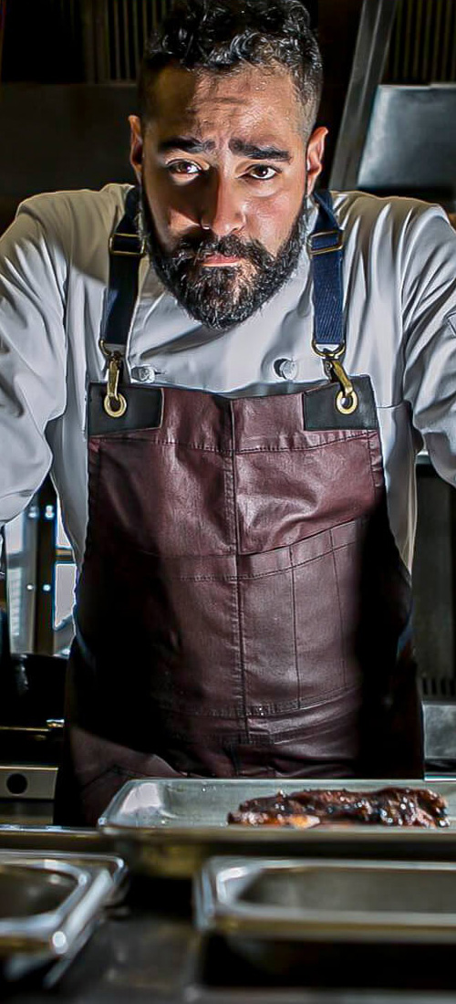 Chef David Barazarte In The Kitchen With Apron