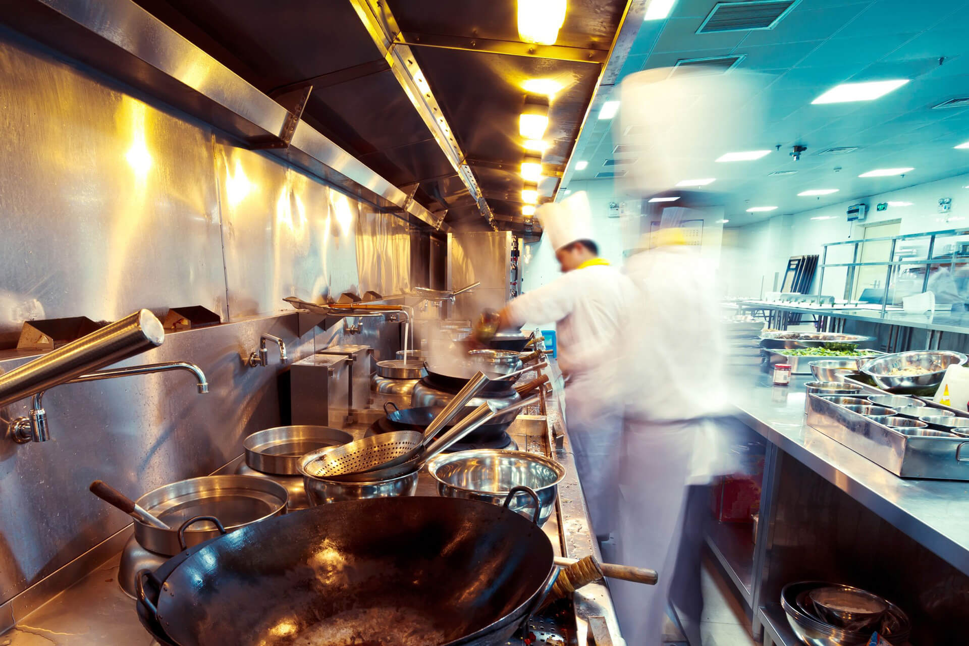 View of a busy kitchen with motion blur