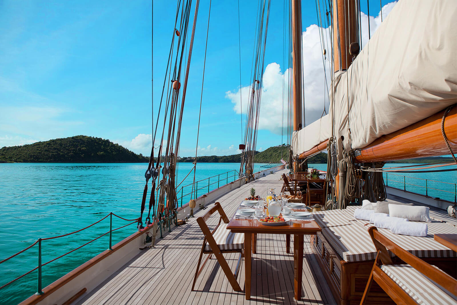 View on deck of large sailboat with table and chairs